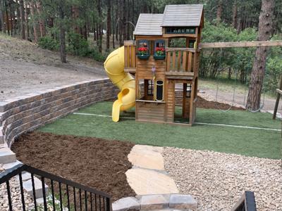 Segmental retaining wall with recycled artificial turf in Monument Colorado