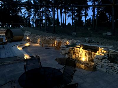 	Siloam stone retaining wall, pond-less water feature, in ground fire pit, veneer stoned stairs up the deck