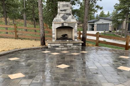 Clik to view full size Paver patio, veneer stoned fireplace for a gas insert in Monument Colorado