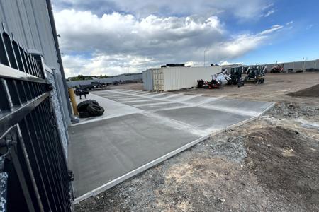 New Concrete apron for Peak Equipment Rentals in Monument, Colorado behind their bay doors and this has saw cut joints, which makes it easier to roll over. This has fiber mesh as well as all the rebar