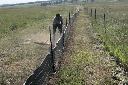 Clik to view full size Silt fence installation. Installing silt fence in Black Forest, Colorado