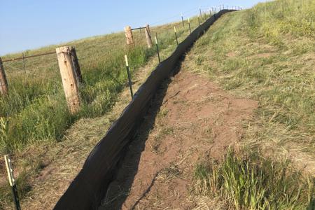 Clik to view full size Installed wired back silt fence in Black Forest, Colorado