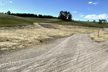 Erosion control in Black Forest, Colorado. Seed and straw crimp an area in Black Forest, Colorado to help with grass seed germination and to control the amount of dirt that transfers