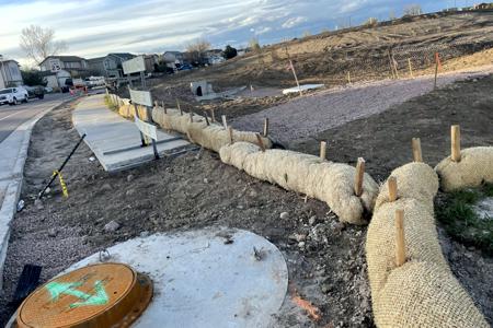 Erosion control Colorado Springs. Installed Straw Waddles in Colorado Springs to keep the dirt contained to construction site.