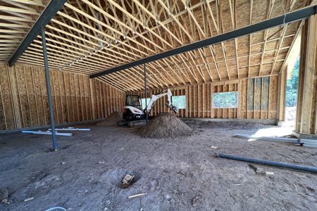 Clik to view full size Excavating the plumbing for a bathroom inside a detached garage in Larkspur, Colorado