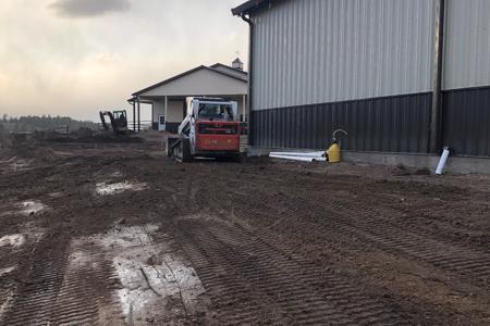 Clik to view full size Final grading a new barn in Larkspur, Colorado