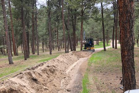 Clik to view full size Excavating in Black Forest, Colorado for a new electrical line
