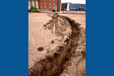 Excavating in Colorado Springs. Excavating for the power lines that will be for the parking lot lights.