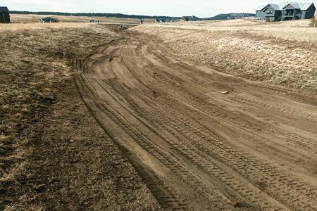 Excavating in Black forest, Colorado. Excavating a water channel in a subdivision so that we can install erosion control measures and get grass to grow.