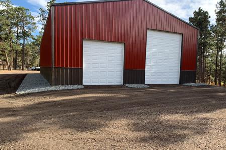 Click to view full size Adding rock around this barn and re-grading in Black Forest, Colorado