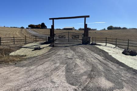 Driveway gate Larkspur, Colorado. Installed a solar powered automatic driveway gate, installed fencing to keep cattle in, installed erosion control blankets to help get the grass seed established and graded the driveway accordingly.