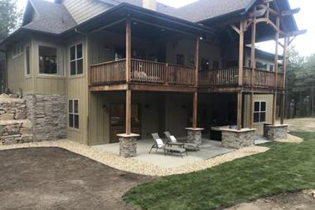 Siloam stone retaining walls with outdoor lighting in Black Forest Colorado