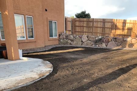 Click to view full size Boulder retaining wall for a client using their own boulders in Colorado Springs, Colorado