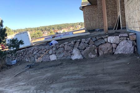Click to view full size Boulder retaining wall in Monument, Colorado
