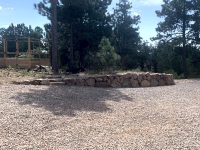 Click to view full size Boulder retaining wall to stop erosion in Black Forest Colorado