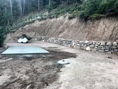 Click to view full size Boulder retaining wall with a concrete of for a shed in Woodmoor Mtn Colorado