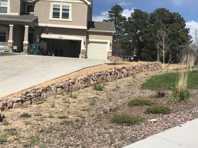 Click to view full size Boulder retaining wall in Monument Colorado