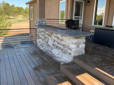 Clik to view full size A veneer stone deck fire pit at a home in Monument, Colorado